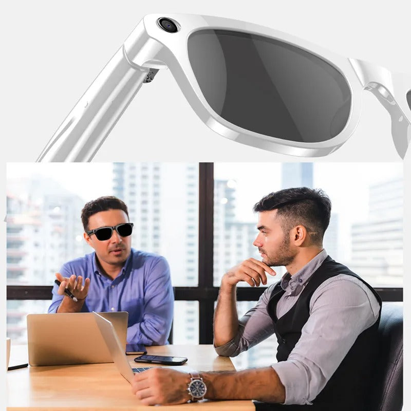 White smart glasses with camera and Bluetooth worn by a man during a business meeting in an office
